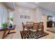 Charming dining room featuring wood table, seating for six, and decorative accent rug at 3712 Rocklin Peak Ave, North Las Vegas, NV 89081