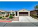 Charming single-story home with a well-manicured front yard and a two-car garage at 3712 Rocklin Peak Ave, North Las Vegas, NV 89081