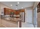 Kitchen with granite counters, tile backsplash, stainless appliances, and sliding door access to patio at 3712 Rocklin Peak Ave, North Las Vegas, NV 89081