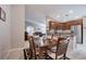 Open kitchen and dining area with stainless steel appliances and granite countertops at 3712 Rocklin Peak Ave, North Las Vegas, NV 89081