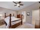 The main bedroom boasts a four-poster bed, neutral decor, and en-suite bathroom at 3712 Rocklin Peak Ave, North Las Vegas, NV 89081
