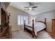 The main bedroom features neutral carpeting, plantation shutters and a wooden four-poster bed at 3712 Rocklin Peak Ave, North Las Vegas, NV 89081