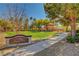Scenic view of Sunset Park featuring a pathway, gazebo, and lush green space at 3712 Rocklin Peak Ave, North Las Vegas, NV 89081