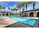 Resort style community pool with beautiful tiling, palm trees and plenty of room to relax at 3712 Rocklin Peak Ave, North Las Vegas, NV 89081