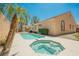 Private backyard oasis with a sparkling pool, hot tub, and lush landscaping, perfect for entertaining at 3882 Genoa Dr, Las Vegas, NV 89141