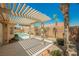 Inviting backyard featuring a covered patio and a refreshing swimming pool, ideal for outdoor enjoyment at 3882 Genoa Dr, Las Vegas, NV 89141