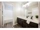 Well-lit bathroom featuring a shower-tub combo, vanity with countertop, and wood-look flooring at 3882 Genoa Dr, Las Vegas, NV 89141