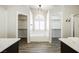 Bright bathroom showcasing a tub and dual walk-in closets with plenty of storage space at 3882 Genoa Dr, Las Vegas, NV 89141