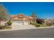 Charming home featuring a well-manicured front yard and a three-car garage, offering ample space at 3882 Genoa Dr, Las Vegas, NV 89141