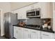 Kitchen featuring stainless steel appliances, granite countertops, and white cabinets at 3882 Genoa Dr, Las Vegas, NV 89141