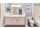 Bathroom featuring double sink vanity and combination shower and tub at 4321 Stockbridge St, Las Vegas, NV 89115