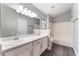 Bathroom featuring double sink vanity and combination shower and tub at 4321 Stockbridge St, Las Vegas, NV 89115
