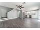 Open-concept room with luxury vinyl plank flooring, neutral walls, and a view of the kitchen at 4321 Stockbridge St, Las Vegas, NV 89115