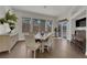 Formal dining room with a wooden table, neutral chairs, and lots of natural light at 439 Pelican Bay Ct, Henderson, NV 89012