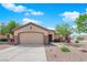 Charming single-story home with a well-maintained front yard and two-car garage at 439 Pelican Bay Ct, Henderson, NV 89012