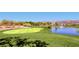 Expansive golf course with a pond and fountain, offering a picturesque and recreational landscape at 439 Pelican Bay Ct, Henderson, NV 89012