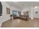 Spacious living room featuring a brown leather sectional sofa and modern decor at 439 Pelican Bay Ct, Henderson, NV 89012