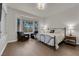 Bright main bedroom with bay windows, hardwood floors, and a cozy sitting area at 439 Pelican Bay Ct, Henderson, NV 89012