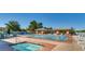 Inviting swimming pool area with spa, lounge chairs, and shaded pavilions, offering a perfect spot for relaxation at 439 Pelican Bay Ct, Henderson, NV 89012