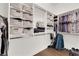 Organized walk-in closet with shelves, baskets, rods, and storage space at 439 Pelican Bay Ct, Henderson, NV 89012