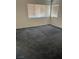 Bedroom with carpet flooring and natural lighting from two windows at 5024 Saint Annes Dr, Las Vegas, NV 89149