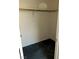 View of a walk-in closet with neutral wall color and carpeted floors at 5024 Saint Annes Dr, Las Vegas, NV 89149