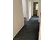 Hallway with neutral paint and carpeted flooring, leading to other areas of the home at 5024 Saint Annes Dr, Las Vegas, NV 89149