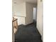 Upstairs hallway with wood railing and neutral-toned walls at 5024 Saint Annes Dr, Las Vegas, NV 89149