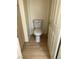 Enclosed toilet room with vinyl flooring, neutral walls, and white toilet at 5024 Saint Annes Dr, Las Vegas, NV 89149