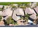 Aerial view of homes with desert landscaping and tiled roofs at 512 Pima Canyon Ct, Las Vegas, NV 89144