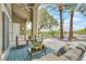 Inviting covered back patio with seating, overlooking the yard at 512 Pima Canyon Ct, Las Vegas, NV 89144