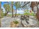 Landscaped backyard with outdoor dining set and desert foliage at 512 Pima Canyon Ct, Las Vegas, NV 89144
