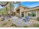 Landscaped backyard with desert landscaping and outdoor seating at 512 Pima Canyon Ct, Las Vegas, NV 89144