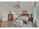 Primary bedroom featuring wood floors and a tray ceiling at 512 Pima Canyon Ct, Las Vegas, NV 89144