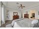 Primary bedroom features wood floors and access to a walk-in closet at 512 Pima Canyon Ct, Las Vegas, NV 89144