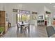 Dining room with wood floors and view to outdoor dining and green space at 512 Pima Canyon Ct, Las Vegas, NV 89144