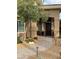 Beautiful front entrance with mature tree, stone path, and covered entrance at 512 Pima Canyon Ct, Las Vegas, NV 89144