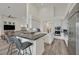 Modern kitchen with quartz countertops, island, bar seating and stainless steel appliances at 512 Pima Canyon Ct, Las Vegas, NV 89144