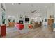 Spacious living room featuring vaulted ceilings, fireplace, ceiling fan, and lots of light at 512 Pima Canyon Ct, Las Vegas, NV 89144
