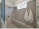 Walk-in shower featuring a shower bench and rain shower head at 512 Pima Canyon Ct, Las Vegas, NV 89144