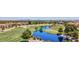 An aerial view of the golf course, ponds and neighborhood surrounded by mountains at 5142 Southern Hills Ln, Las Vegas, NV 89113