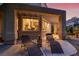 Relaxing backyard patio with lounge chairs, covered area, and a serene view into the home's inviting interior at 5142 Southern Hills Ln, Las Vegas, NV 89113