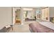 Bright and airy bedroom with mirrored closet doors, offering a comfortable space and a calming view of the outdoors at 5142 Southern Hills Ln, Las Vegas, NV 89113