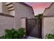 Charming courtyard gate with address plaque, offering privacy and curb appeal to this lovely property at 5142 Southern Hills Ln, Las Vegas, NV 89113
