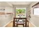 Bright dining area with natural light and a view of the backyard at 5142 Southern Hills Ln, Las Vegas, NV 89113