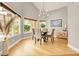 Dining room with hardwood floors, ample windows and a modern light fixture at 5142 Southern Hills Ln, Las Vegas, NV 89113