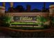 A Villas community entrance with a brick surround, and manicured landscaping at 5142 Southern Hills Ln, Las Vegas, NV 89113