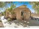 Picturesque exterior showcasing a covered patio, desert landscaping, and warm architectural details, highlighting its curb appeal at 5142 Southern Hills Ln, Las Vegas, NV 89113