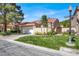Charming exterior view of the home showcasing well-maintained landscaping, curb appeal, and a neatly manicured lawn at 5142 Southern Hills Ln, Las Vegas, NV 89113