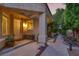 Welcoming front porch with decorative plants, offering a cozy entrance to the home and comfortable seating at 5142 Southern Hills Ln, Las Vegas, NV 89113